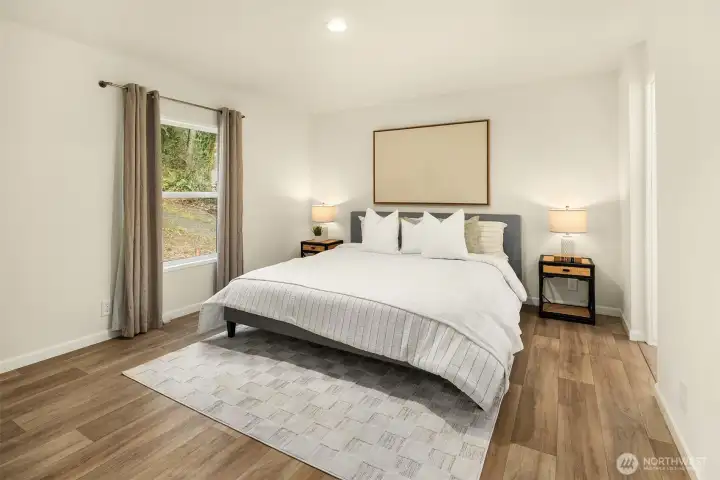 Spacious primary bedroom with a relaxing atmosphere