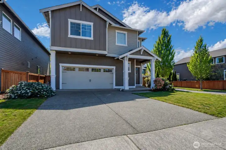 Beautifully maintained home on desirable corner lot with 2-car garage