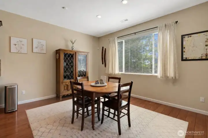 Dining area sits right off the kitchen and living space, overlooking the backyard.