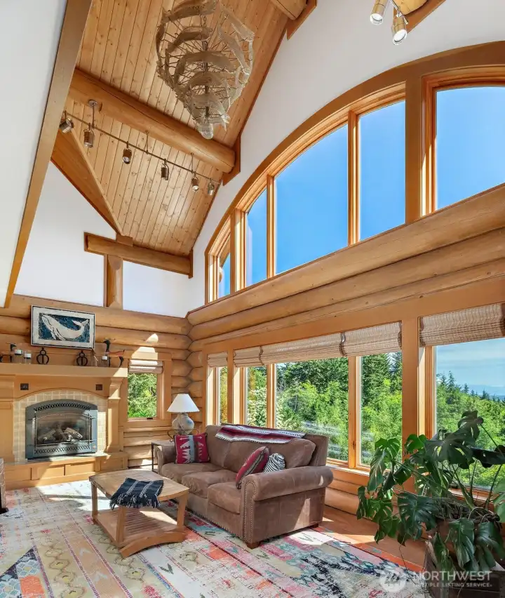 Another view of the living room showing the gorgeous wood ceiling as well as the blown glass light sculpture (stays with home). Another view of the living room showing the gorgeous wood ceiling as well as the blown glass light sculpture (stays with home).