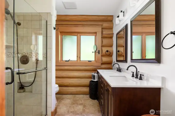 Primary bath has a large walk in shower, 2 sinks, tile flooring and quartz countertops. Primary bath has a large walk in shower, 2 sinks, tile flooring and quartz countertops.