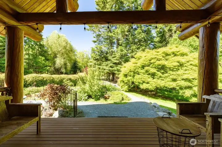Back up on the front porch looking out onto the entry gardens. Back up on the front porch looking out onto the entry gardens.