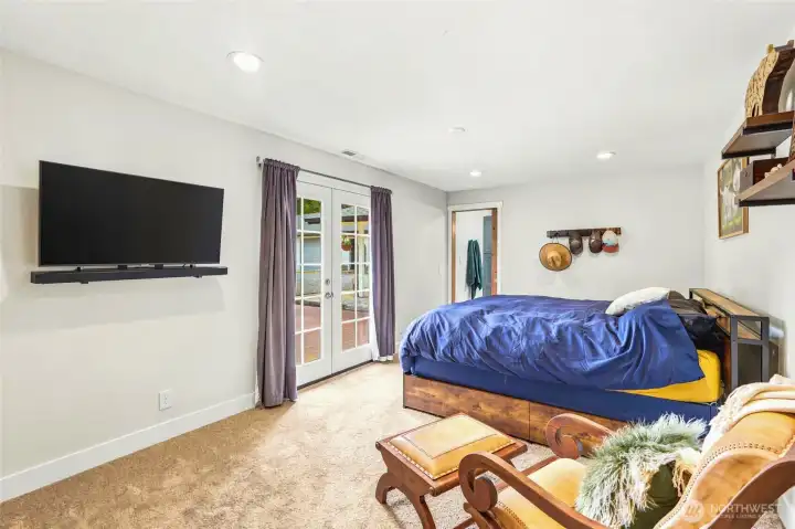 Primary suite with french doors out to the deck.