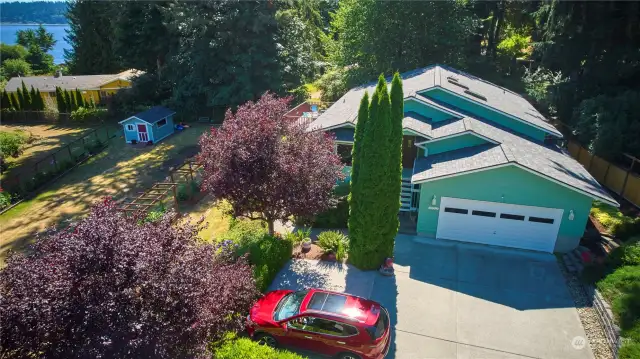 Driveway Drone Shoot of Home And Landscaped Yard W/Garden Shed.