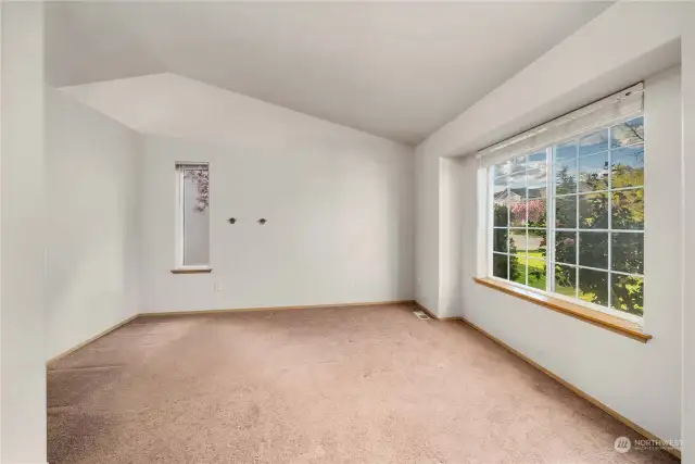 Off the main entrance, this space could be a formal living room or home office.