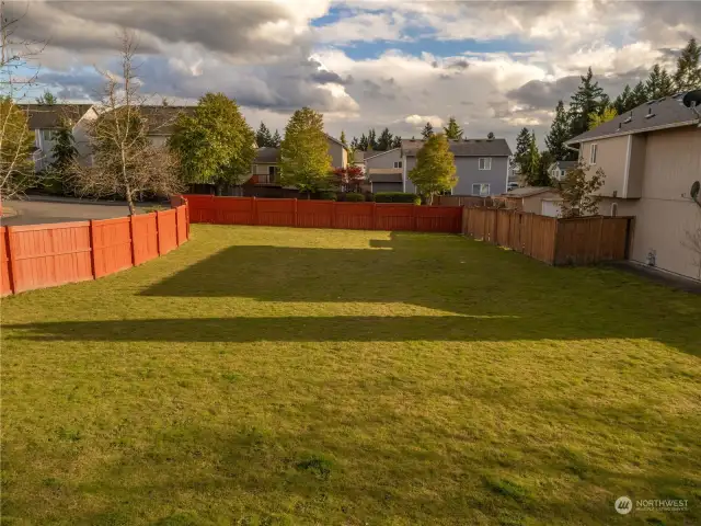 This open space on the left of the home is owned and maintained by the HOA.
