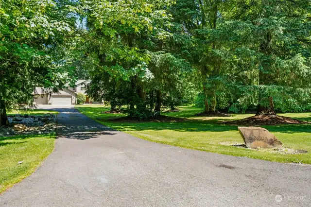 Long paved driveway leads to private & secluded residence.
