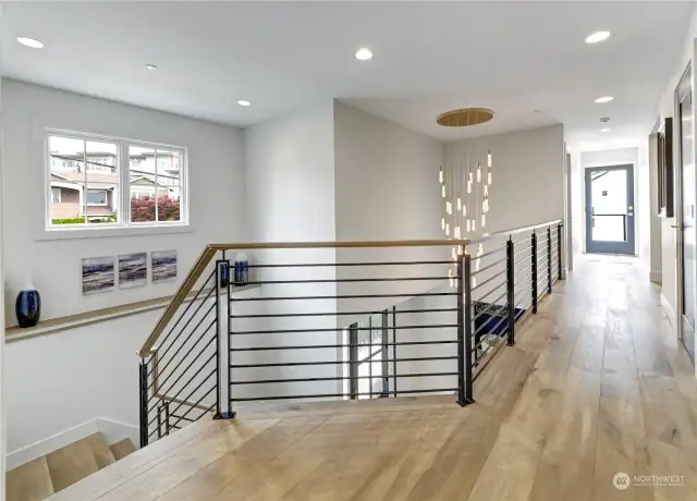 The upstairs landing includes this incredible raindrop chandelier.