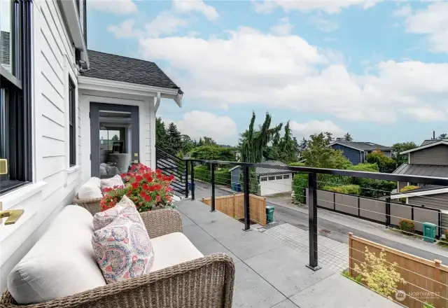 The Juliet balcony with access from the primary bedroom and the family room is a great place to relax.