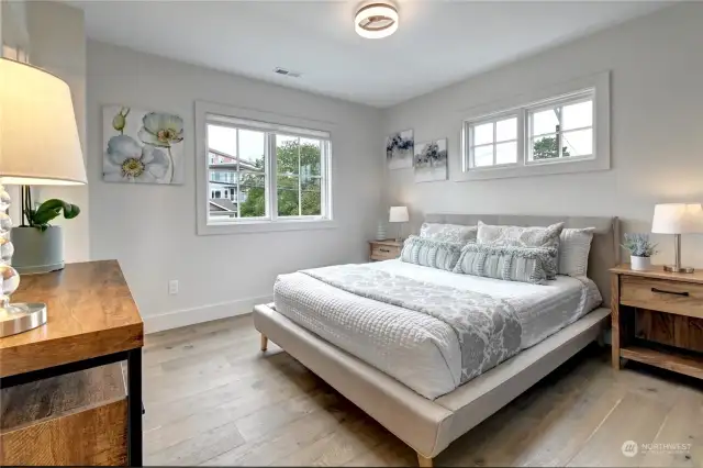 This is the 2nd upstairs bedroom . It has an ensuite bathroom with penny tile.