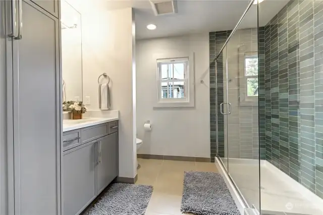 The blue/green tile bathroom.