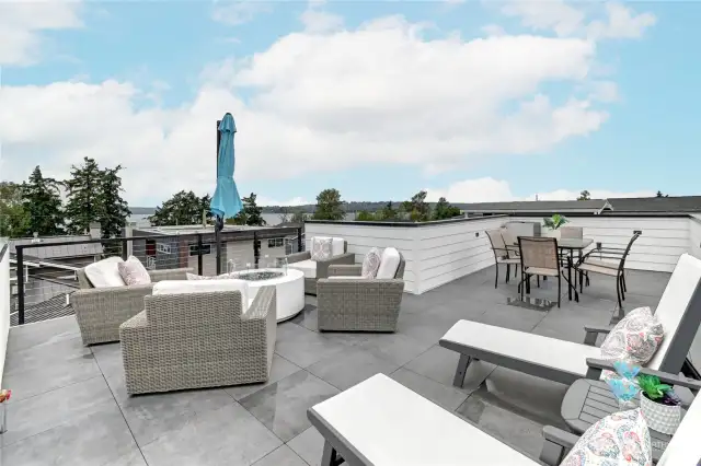 The 762 SF rooftop deck has a 6 person hot tub, an area for a gas fire table, and an area for a dining table. Enjoy  360 degree views of Bellevue, Kirkland, Seattle and Lake Washington.