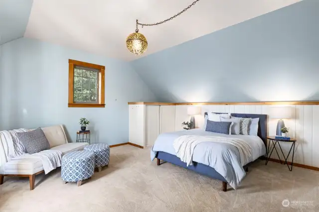 Top of the stairs leading to the primary bedroom space.