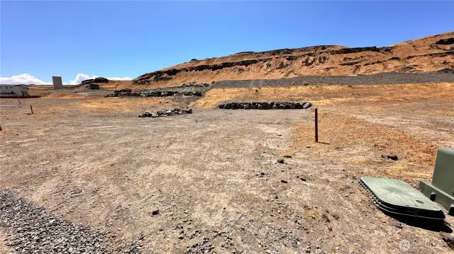 Level lot with retaining wall and utilities at the lot line!