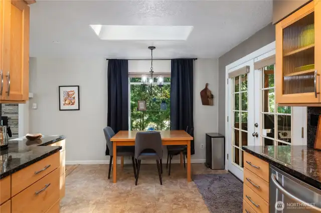 Dining room with a skylight.