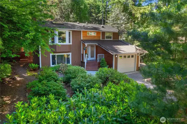 Front view on an angle.  The front even has walking paths through the rhodedendrons.
