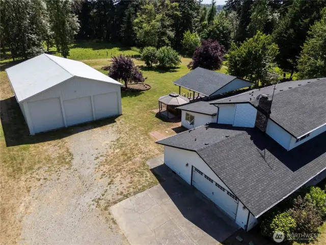 Shop and Attached double car garage with fruit trees in the back (2 apple and 1 plum)