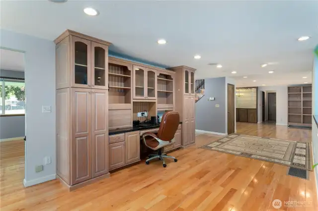 Desk Area looking towards Closet under stairs, dining room and hallway to bathroom and laundry room.  Built in central vacuum system