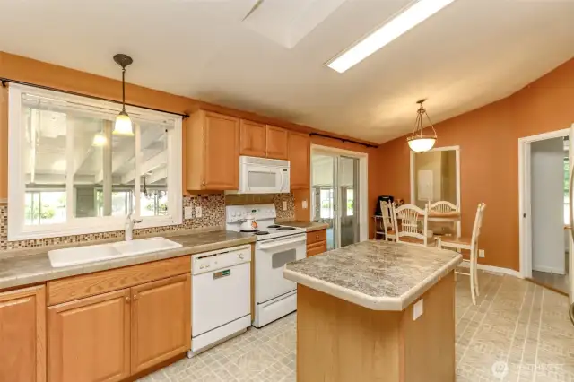 Spacious kitchen with eating space and slider to back patio.