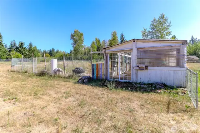 Former barn used for garden space and previously run in shed for livestock. Needs TLC.