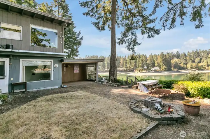 Main house features ample yard space, firepit and a gorgeous view overlooking the best part of Filucy Bay
