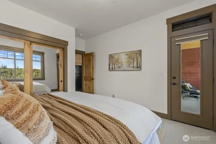 The bedroom feels like a retreat of its own, offering sweeping views and direct access to the balcony for a peaceful escape.