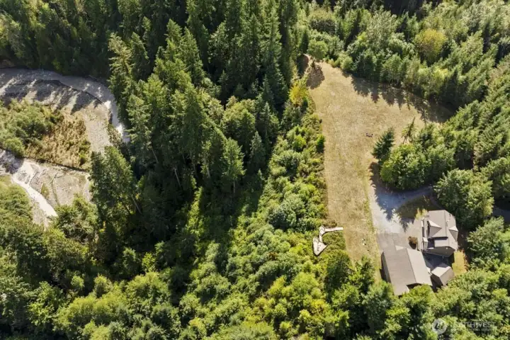 An aerial view reveals the ultimate privacy and scale of this 33.5-acre estate.