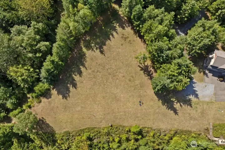 The flat lot is a blank canvas—ready to be transformed into a stunning new residence or expanded retreat.
