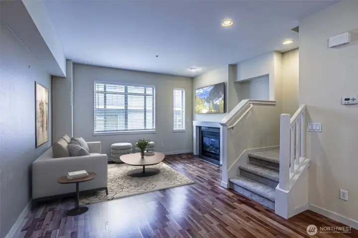 Great room with gas fireplace is part of the great room floor plan.  (Virtually staged)