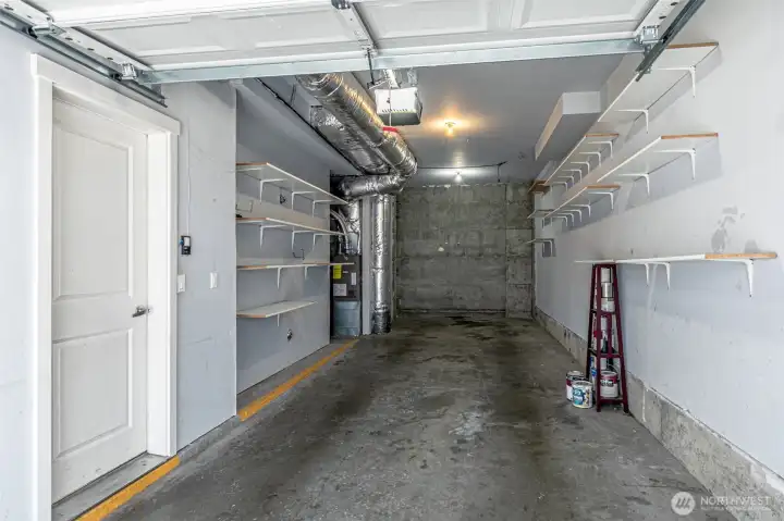 Tandom Garage with high ceilings for storage options.  Hose bib on the left.