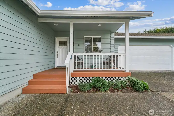 Covered front porch entry.  The exterior has just been painted.