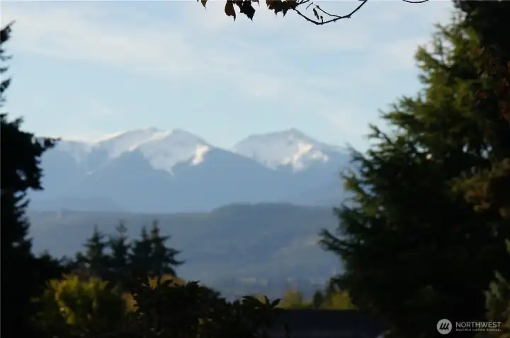 This is the peek-a-boo view of the mountains. range from the backyard.