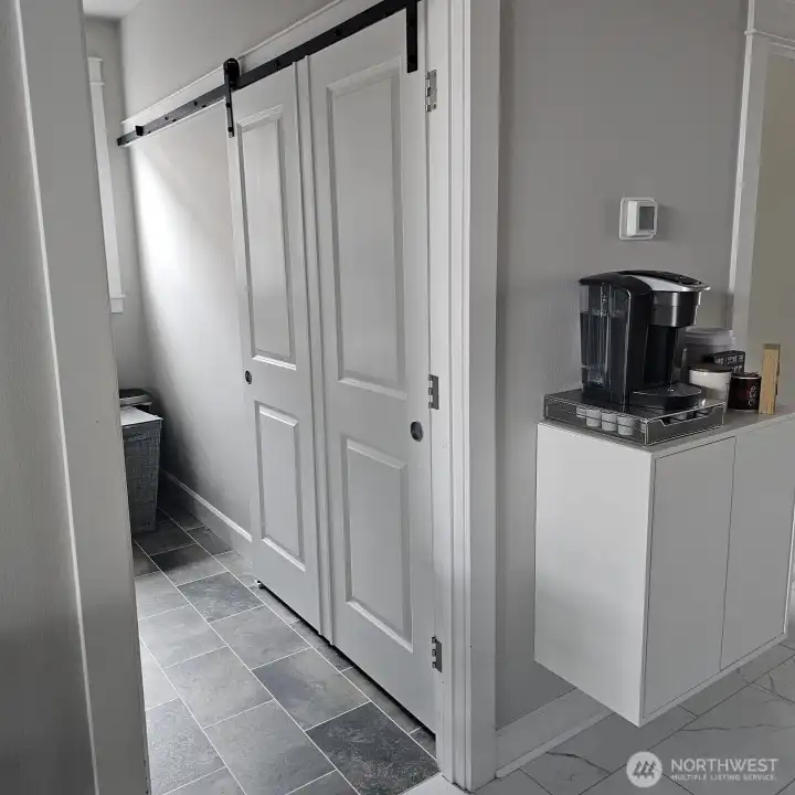 Barn door behind the laundry room door. Right now the door was off the hinge.