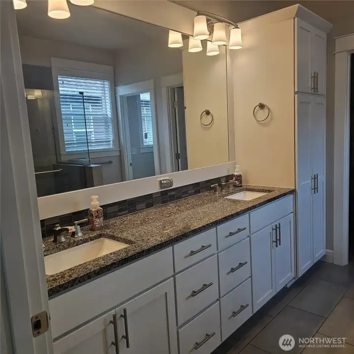 Master bedroom with two sinks.
