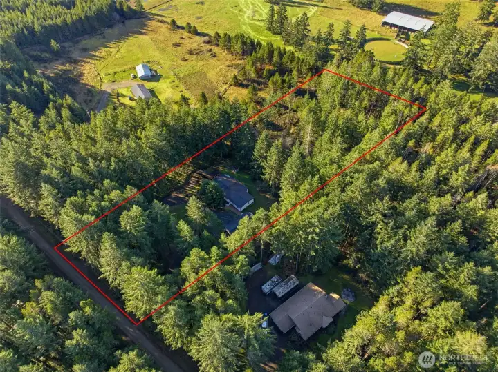Lines are approximate, 2.45-acre home, shop, covered rv parking and well house.