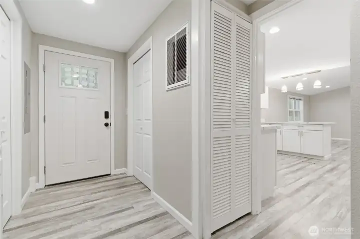 Entry way, laundry units are to the left, opens up to kitchen/ living room.
