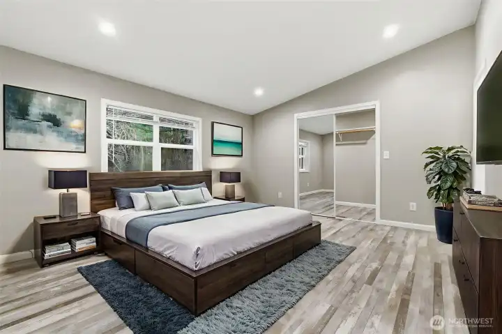 Virtually Staged primary bedroom, vaulted ceilings bring light and luxury into this space.