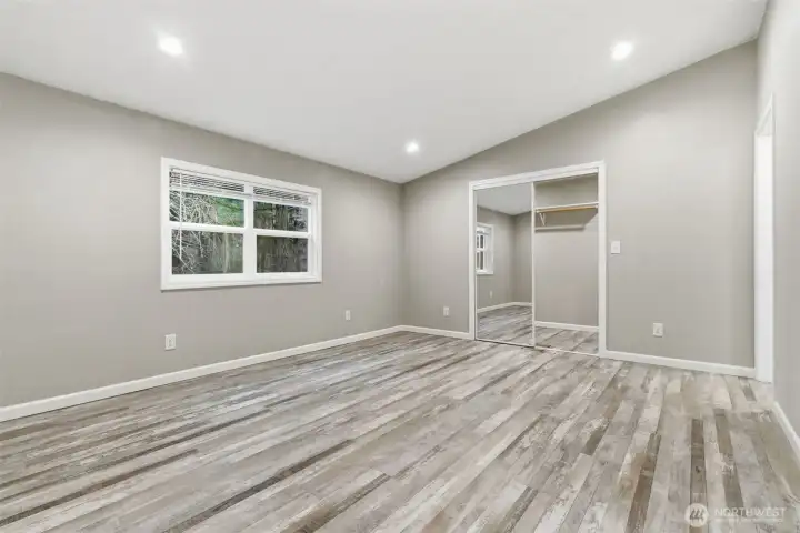 Very spacious primary bedroom with walk-in closest and 5 piece bathroom.