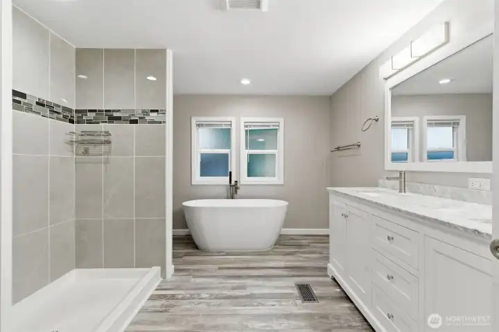 Two sinks, with custom under cabinets, featuring soft close drawers.