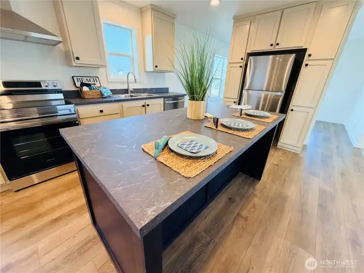 Large island fits three eating spaces and lots of room for entertaining.