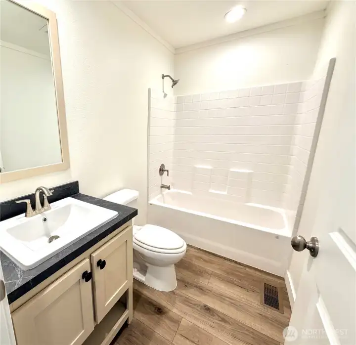 Beautiful full bathroom in hallway