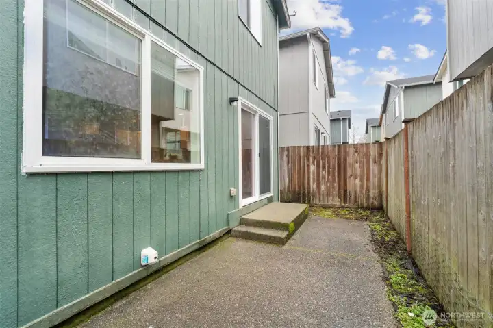 Step out to the fully-fenced low-maintenance back patio for some fresh air. New vinyl slider door and new vinyl living room window.