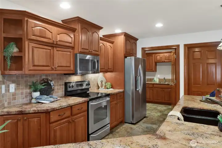 Huge kitchen with tons of storage, including a walk in pantry.