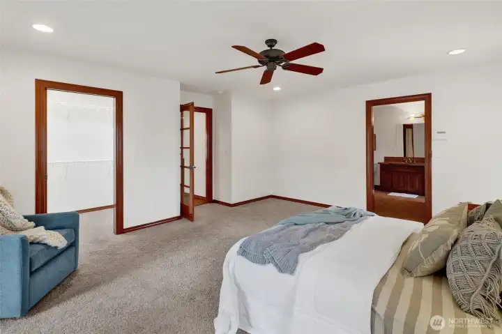Primary bedroom with view of walk in closet.