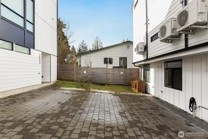 Rear of building with private parking & EV charger