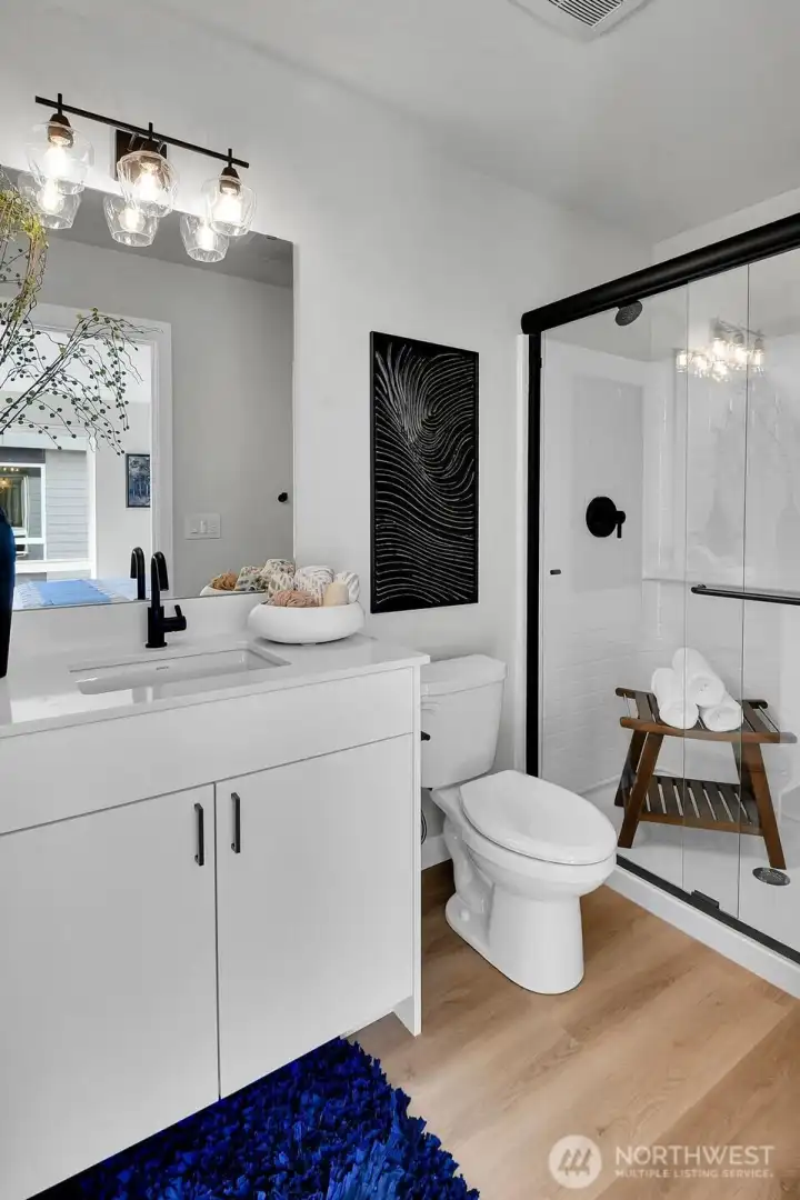 Stylish and bright Primary Bath with a large walk-in shower!