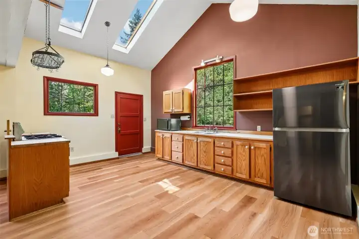 Spacious kitchen with vaulted ceiling and natural light