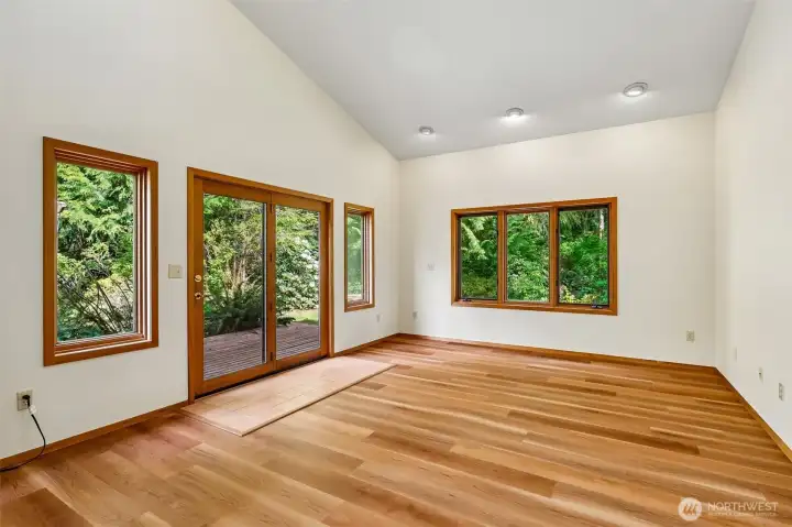 Living room with large windows and deck access