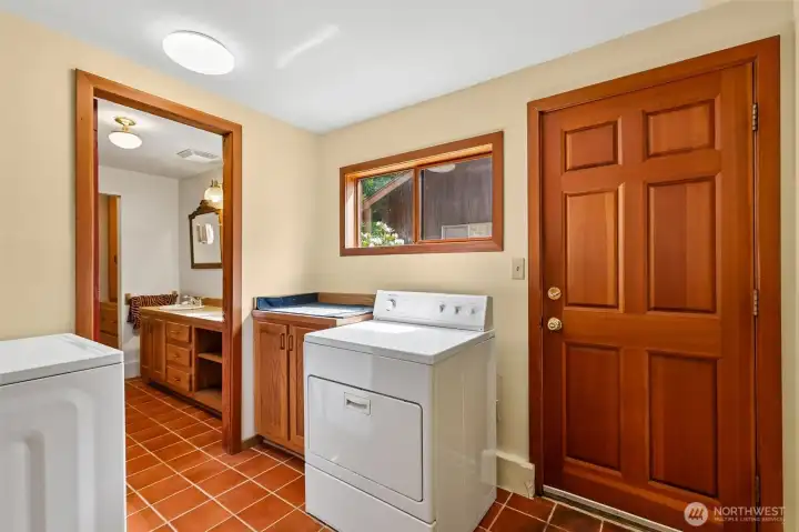 Laundry area with adjacent bath access