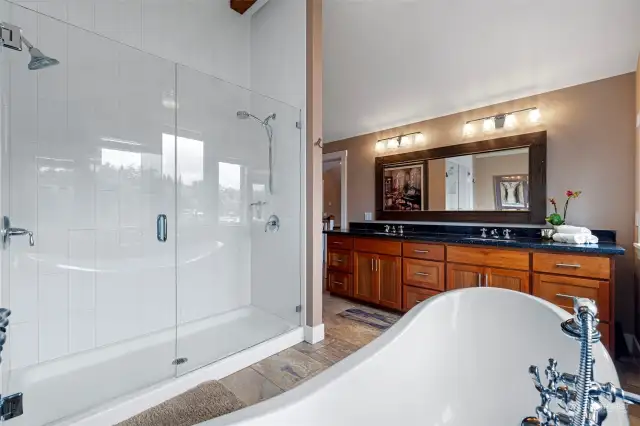 Spa-like bathroom with double vanity, soaking tub and walk in shower.